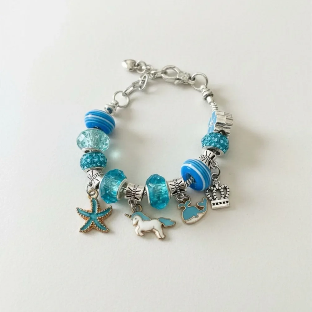 Child’s Silver Tone Blue Unicorn Charm and Glass Bead Bracelet